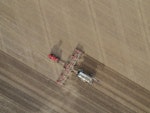 aerial-overhead-shot-fertilizer-machine-farming-field-daytime.jpg